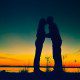Couple kissing during sunset