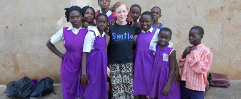 Ugandan school children with a girl on a mission trip