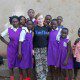 Ugandan school children with a girl on a mission trip