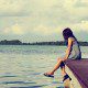 Girl alone on a dock