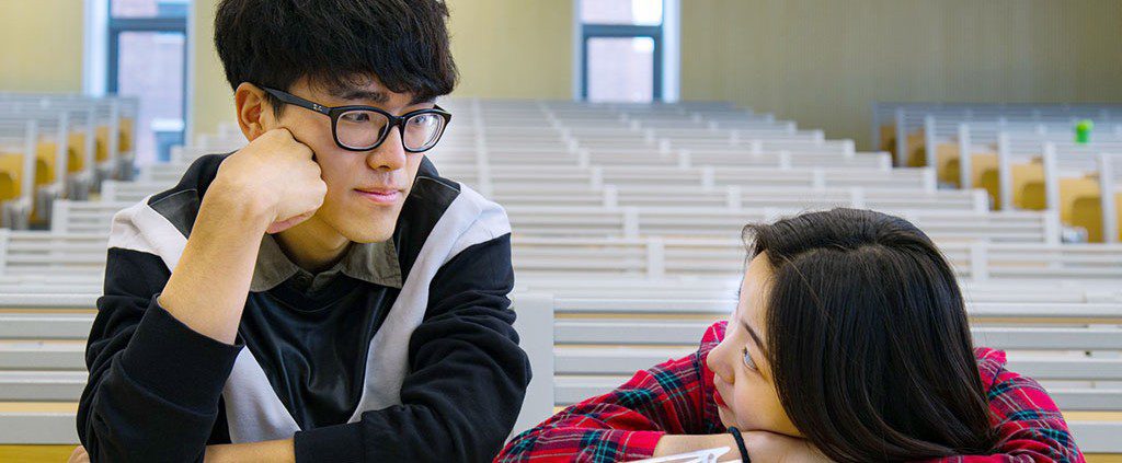 Couple arguing in a lecture hall