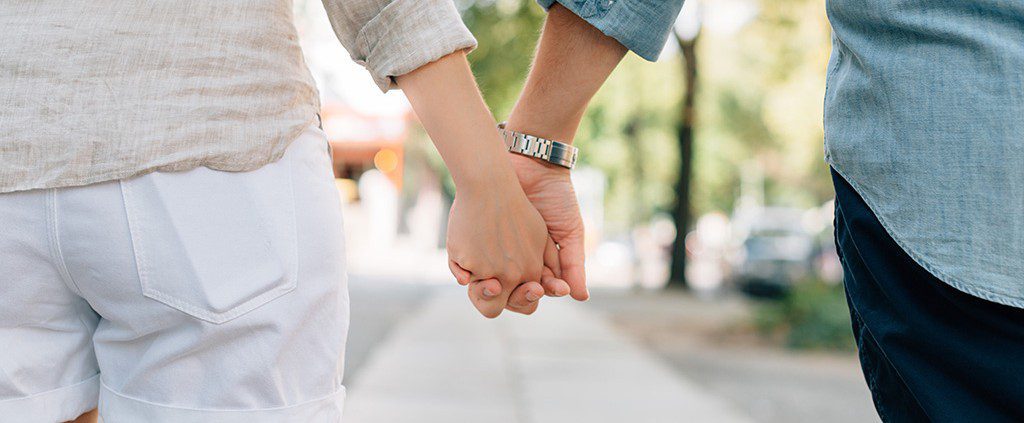 Couple holding hands in a park