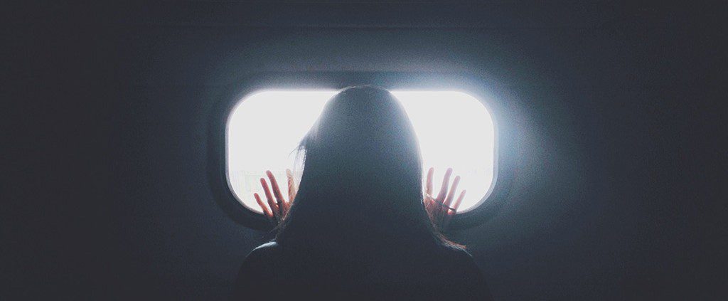 Girl looking out of a window