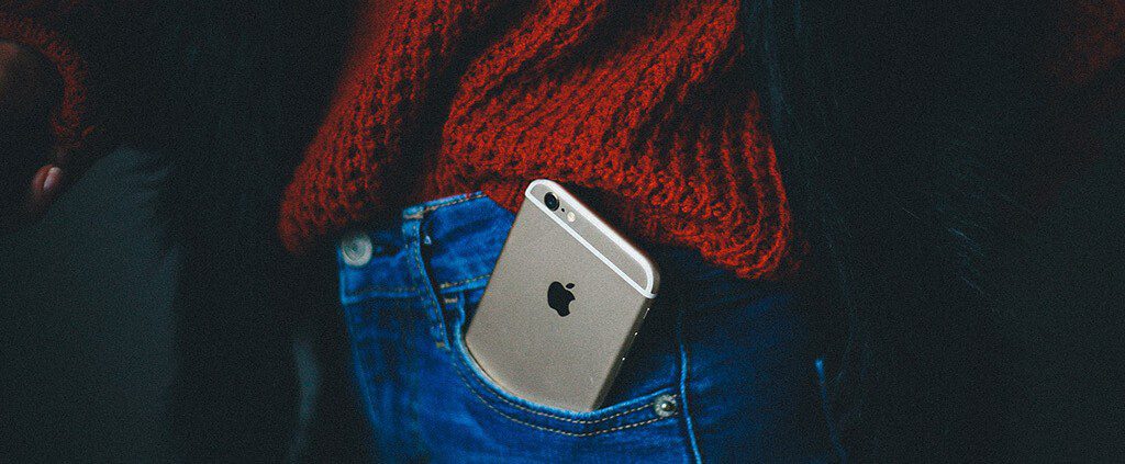 iPhone popping out of jeans pocket