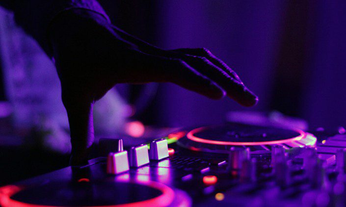 DJ using his machine at a night club