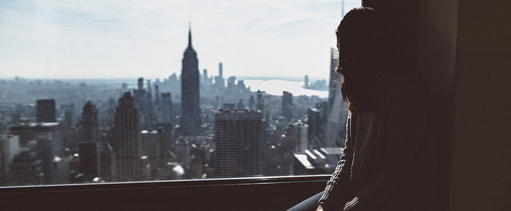 Woman looking out over the New York skyline