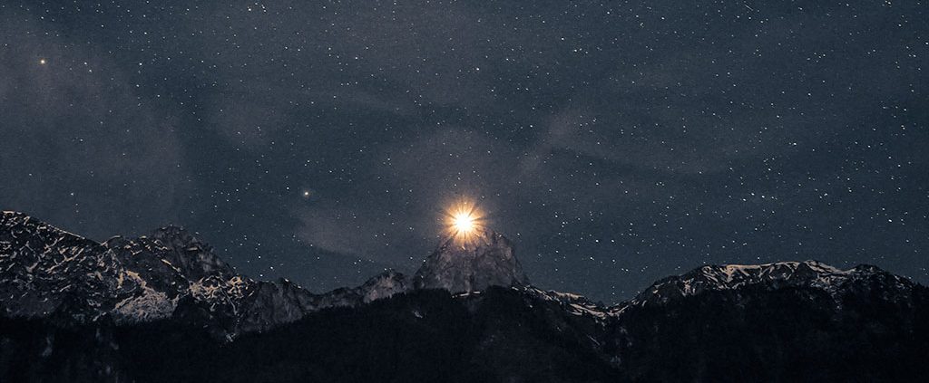 North star rising over a mountain peak