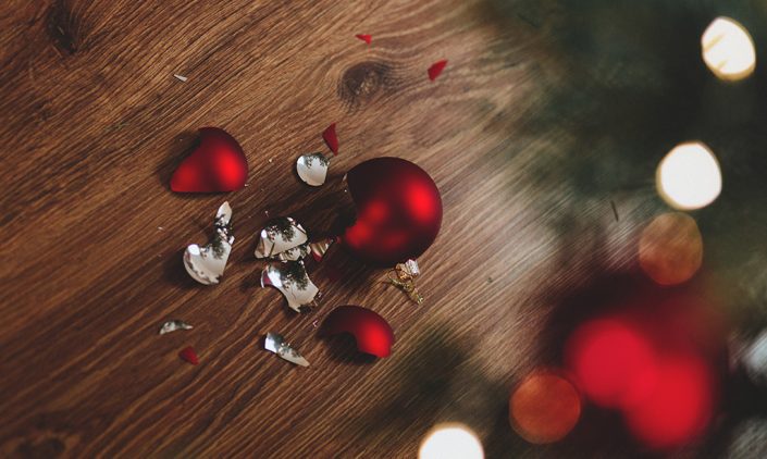 Broken Christmas ornament on the floor shattered