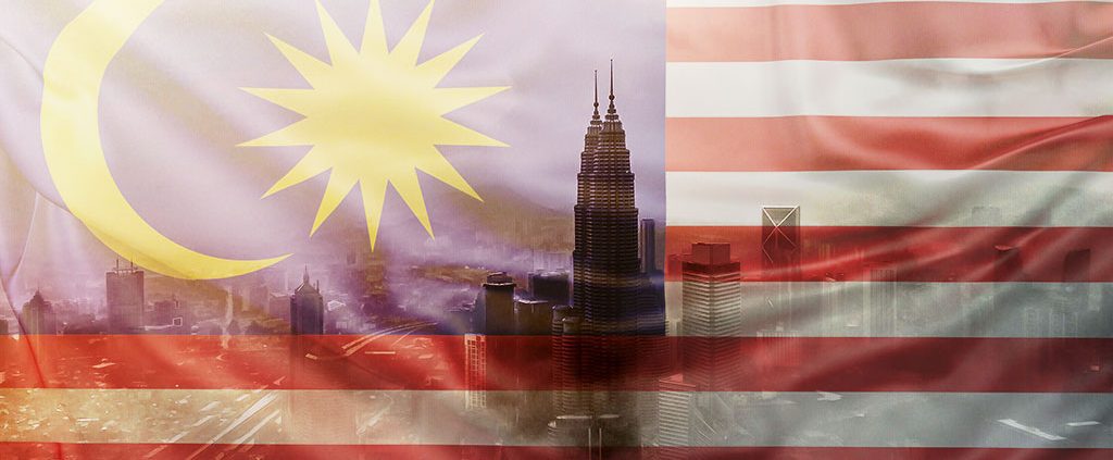 Malaysian flag overlaid the skyline