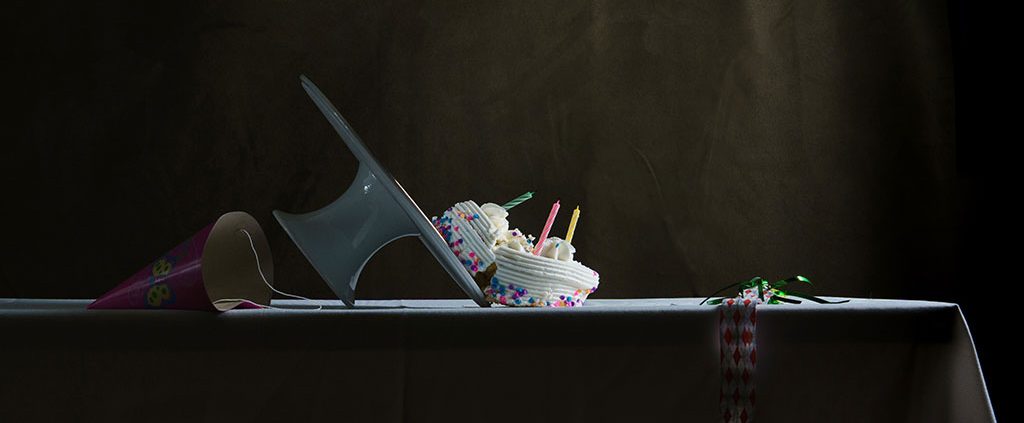 A cake falling off of it's stand