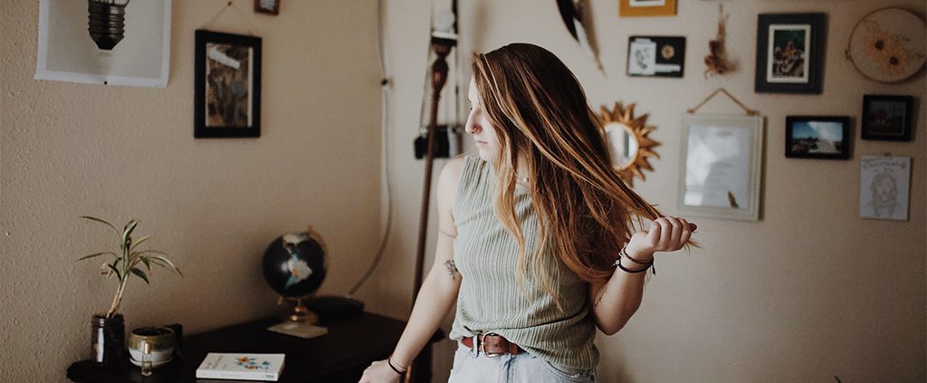 Woman running her hands through her hair