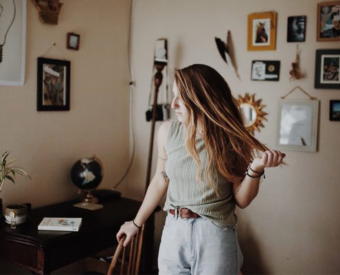 Woman running her hands through her hair