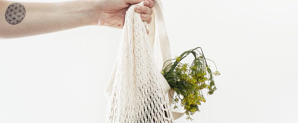 Flowers being held in a string bag