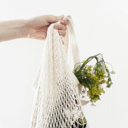 Flowers being held in a string bag
