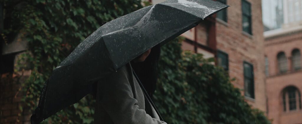 woman holding an umbrella on a rainy day