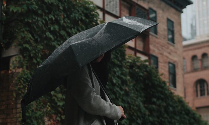 woman holding an umbrella on a rainy day