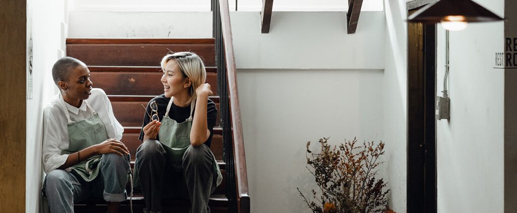 image of a friendship, two women talk together