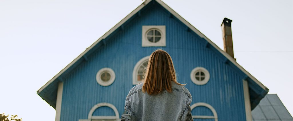 image of lady looking at a front entrance of a church