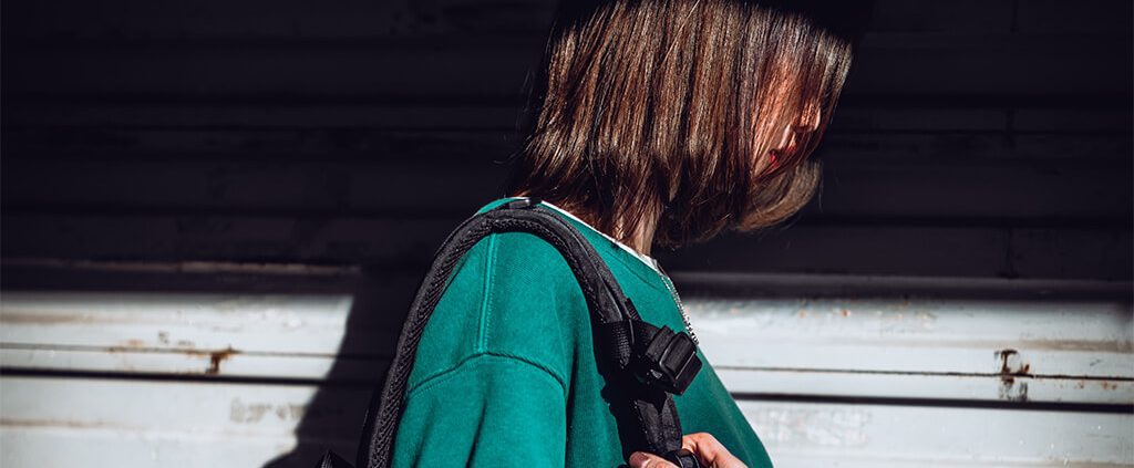 Image of girl with face covered in shadow