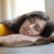 A woman fall asleep when reading bible