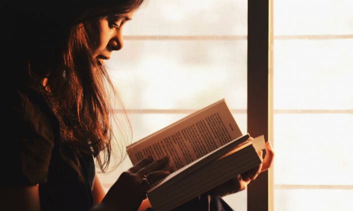 A girl is reading bible