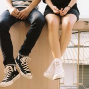 Couple sitting on a wall together