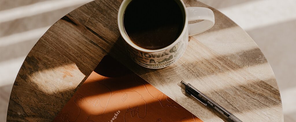 Image of a journal and coffee mug