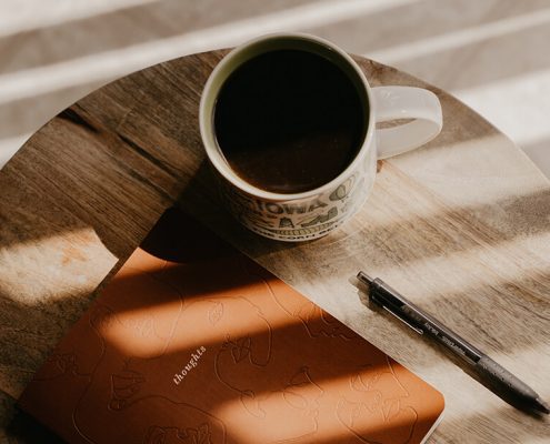 Image of a journal and coffee mug