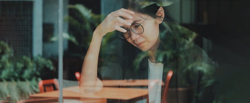 a woman looks mixed feeling