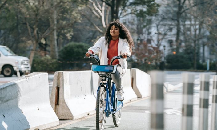 A girl happily cycling around