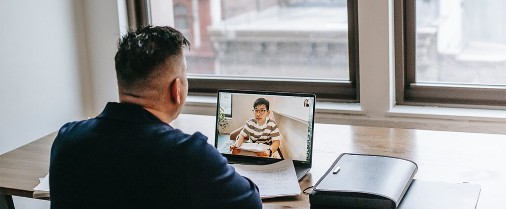 Image of two men on a zoom meeting