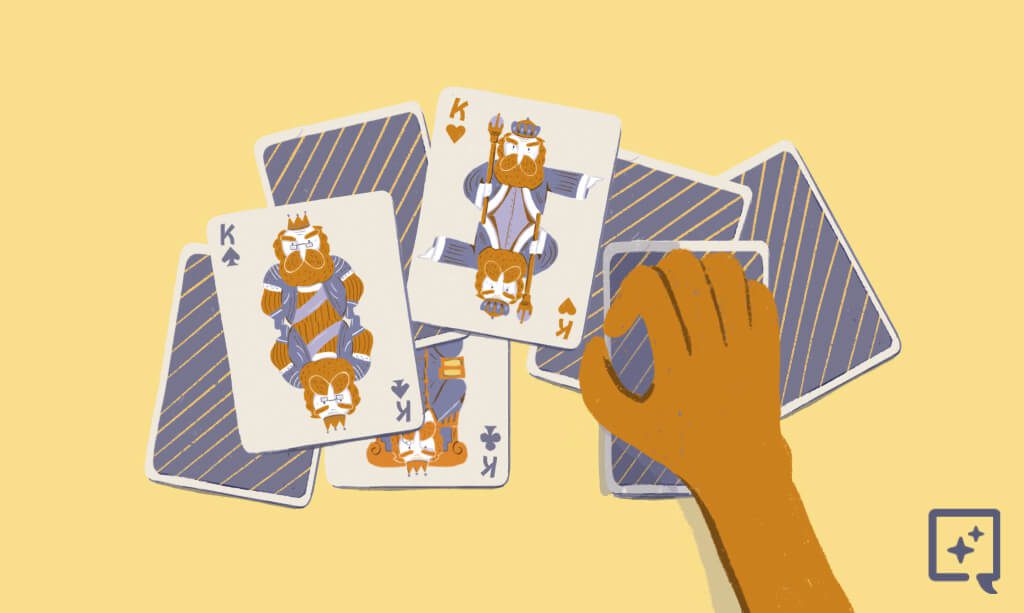A hand is going to reveal the playing card