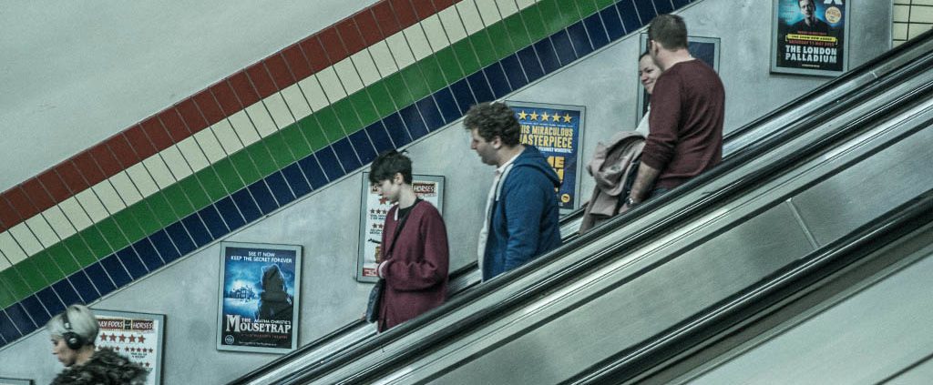 People on escalator in a subway station