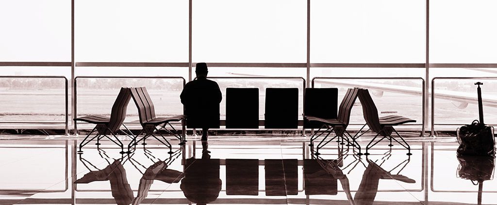 Person contemplating in airport waiting gate