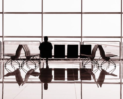 Person contemplating in airport waiting gate