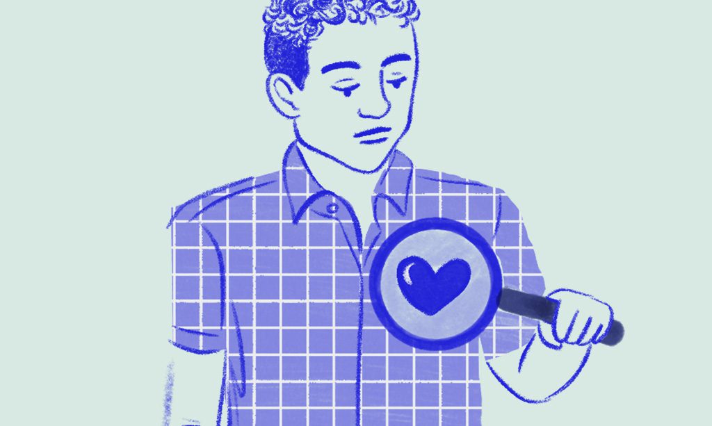 Person putting a magnifying glass on his heart