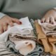 A woman with folded clean baby clothes